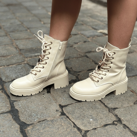 White combat boots on a stone pavement
